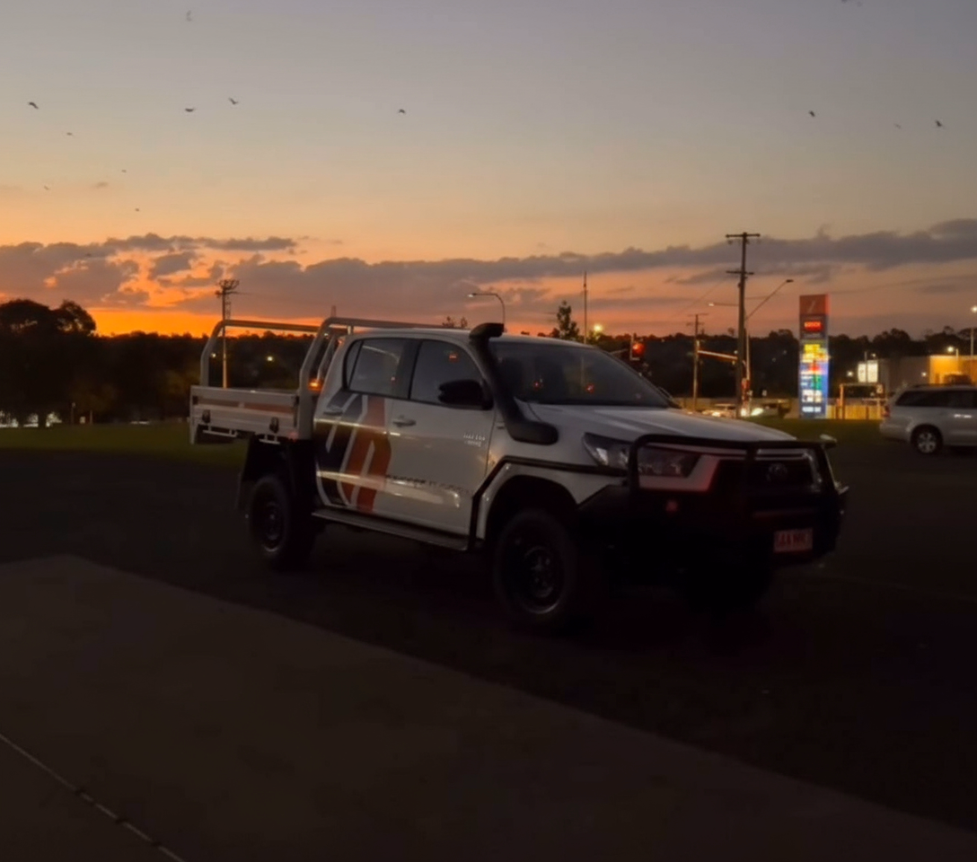 Professional flooring installation process showing expert craftsmen installing quality flooring with precision tools