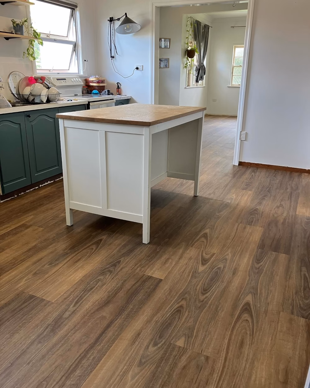 Kitchen and dining area with premium vinyl plank flooring ideal for high-traffic family spaces